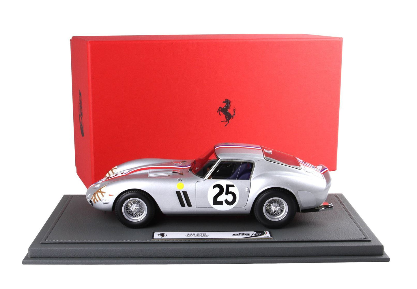 Silver Ferrari 250 GTO model car with number 25 on side, displayed on gray base, red Ferrari box behind, available on Vroomi