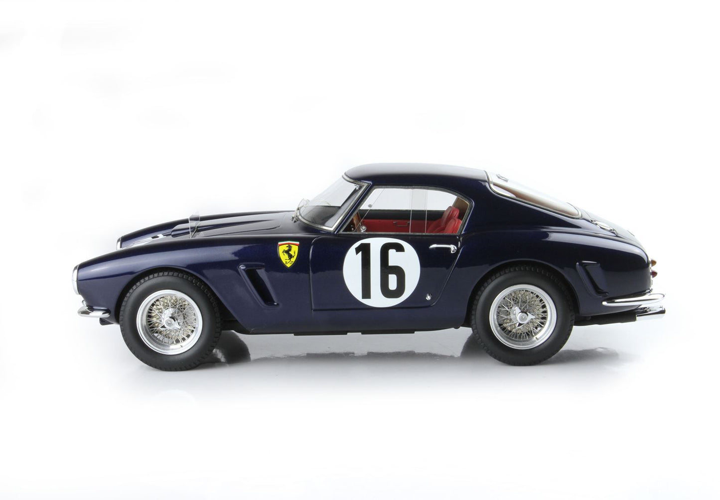 Dark blue vintage Ferrari race car with number 16, wire wheels, and red interior, available via Vroomi