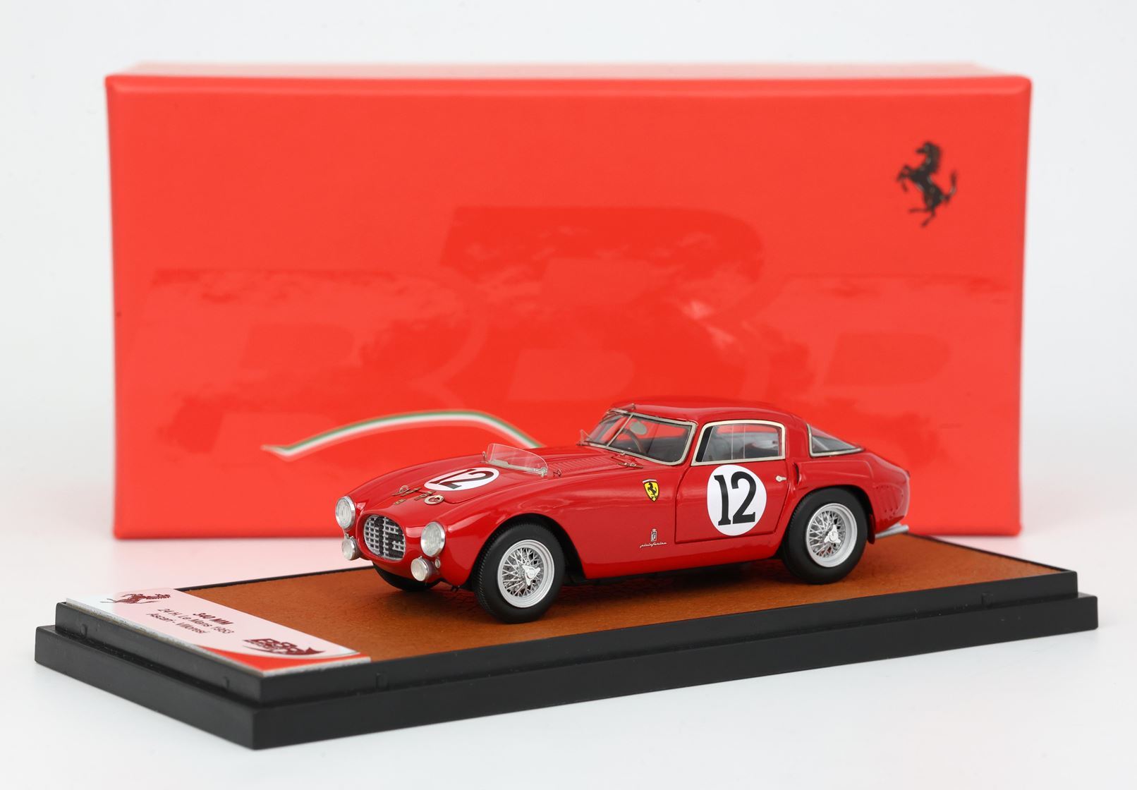 Red Ferrari 340 America 1952 model car with number 12 on display, available through Vroomi