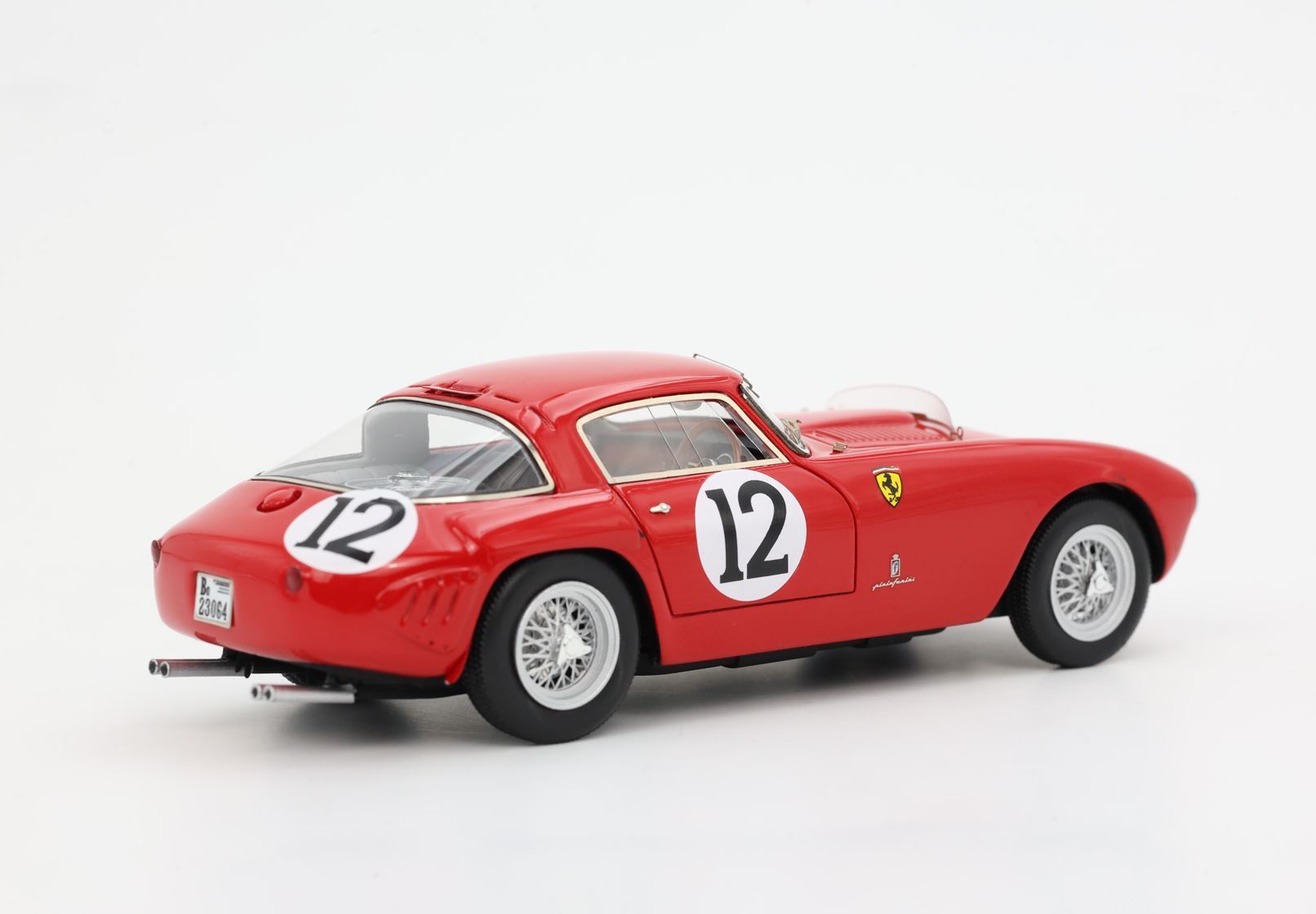 Red classic Ferrari race car model with number 12 decals and wire-spoke wheels, available on Vroomi