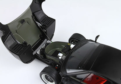 Black sports car front trunk open revealing carbon fiber interior details and components, available on Vroomi platform