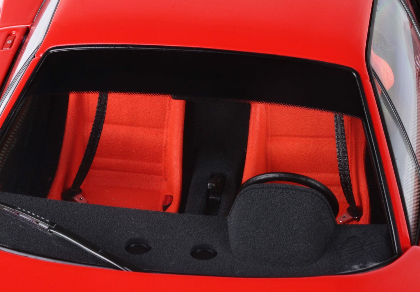 Close-up of red car interior with red seats and black dashboard, available on Vroomi platform