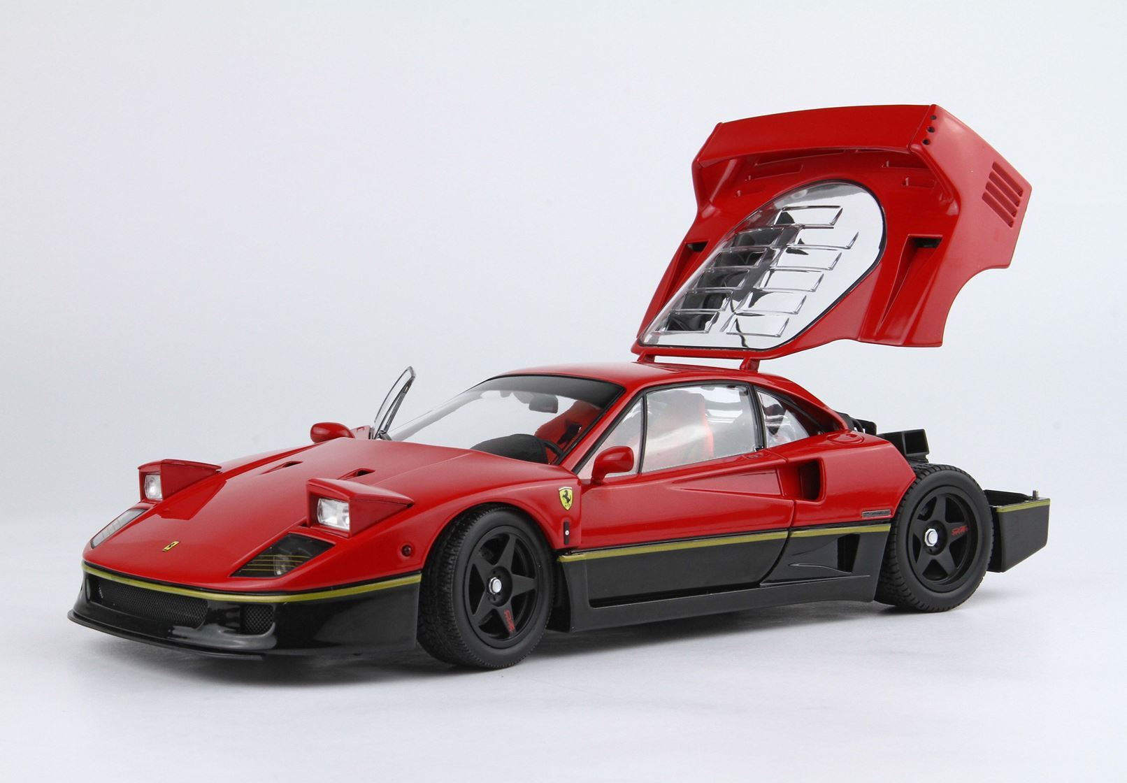 Red Ferrari F40 model car with rear and driver doors open, black lower body, showcased now on Vroomi