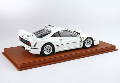 White Ferrari F40 model car on brown display base, available on Vroomi platform
