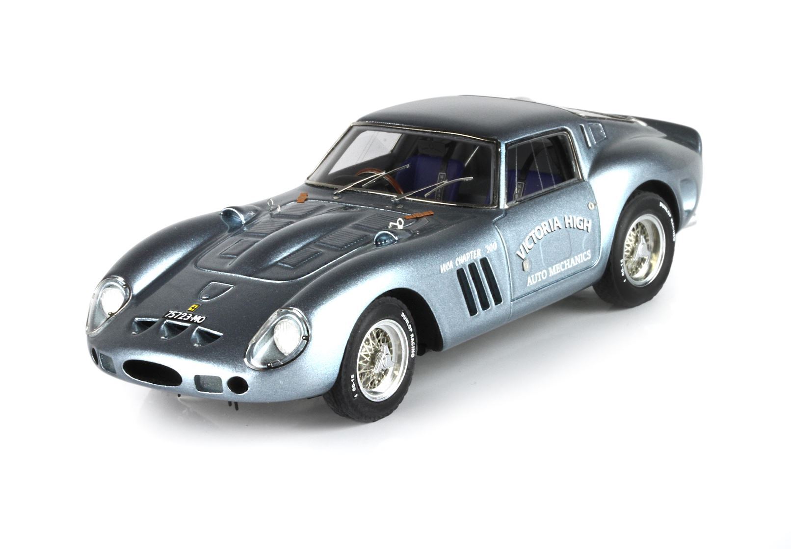 Metallic blue vintage Ferrari model car with Victoria High Auto Mechanics logo, available on Vroomi